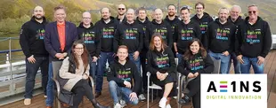 Foto eines Teams von A EINS undNoventum Mitarbeitenden.
