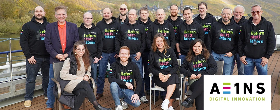 Foto eines Teams von A EINS undNoventum Mitarbeitenden.